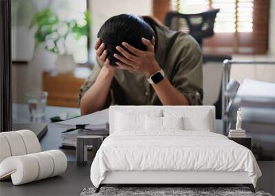 Tired asian business woman overworking and headache stressed Wall mural